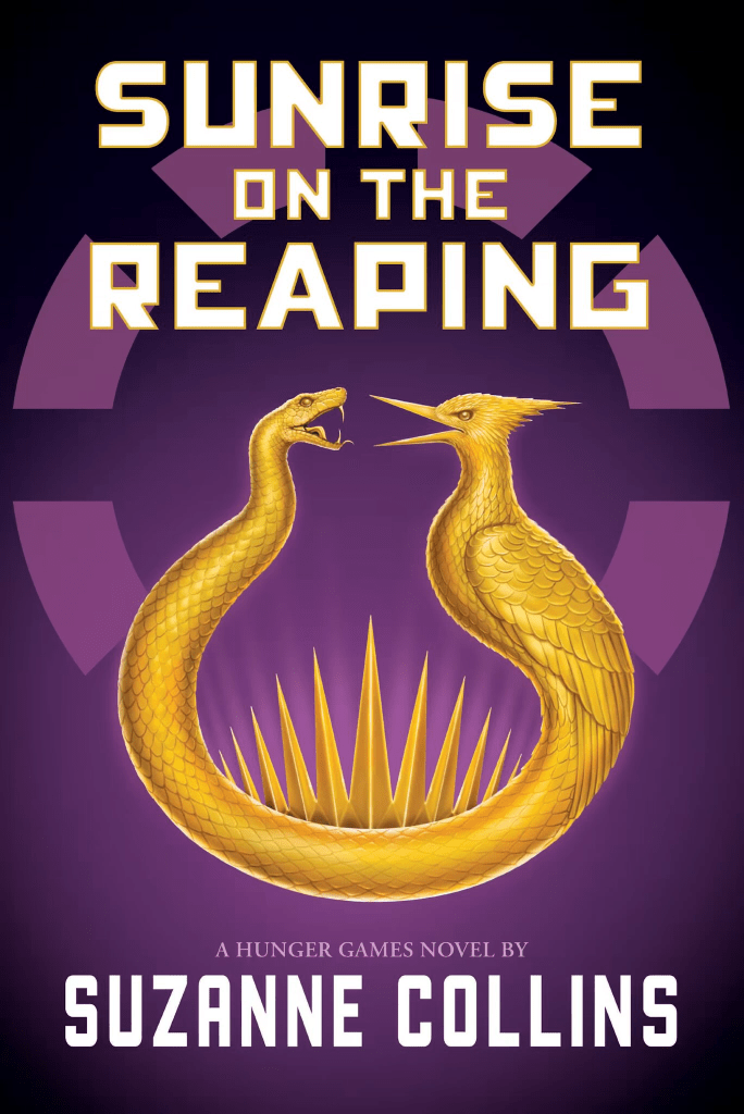 The cover of 'Sunrise on the Reaping' by Suzanne Collins. On a purple background is a golden piece of jewelry shaped like a torc. One end has a snake head, and the other a bird head, and they face each other.